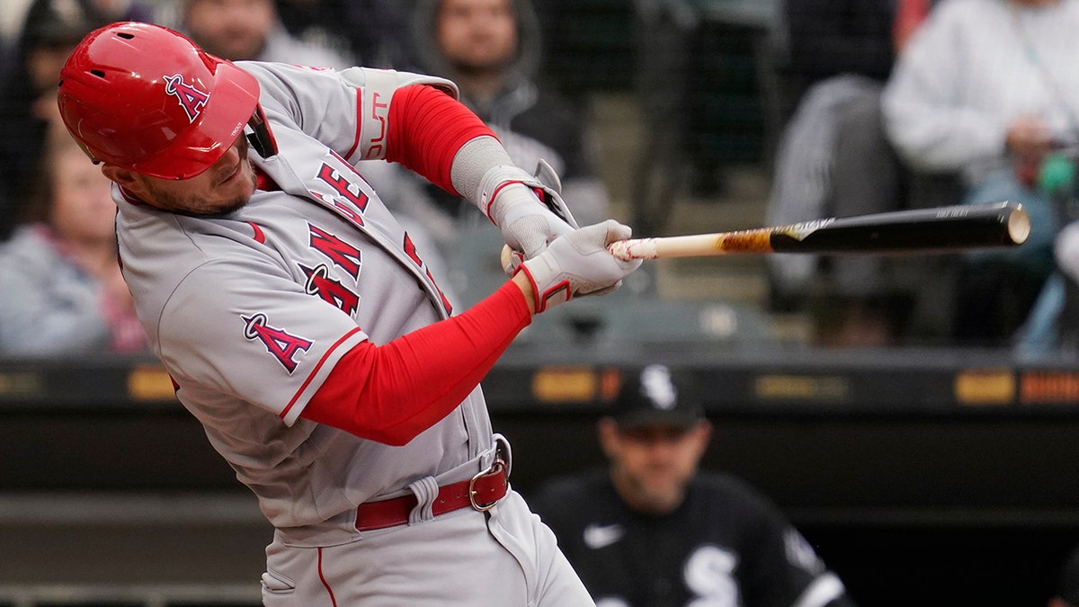 Los Angeles Angels' Mike Trout hits a solo home run during the first inning of a baseball game against the Chicago White Sox in Chicago, Sunday, May 1, 2022. 
