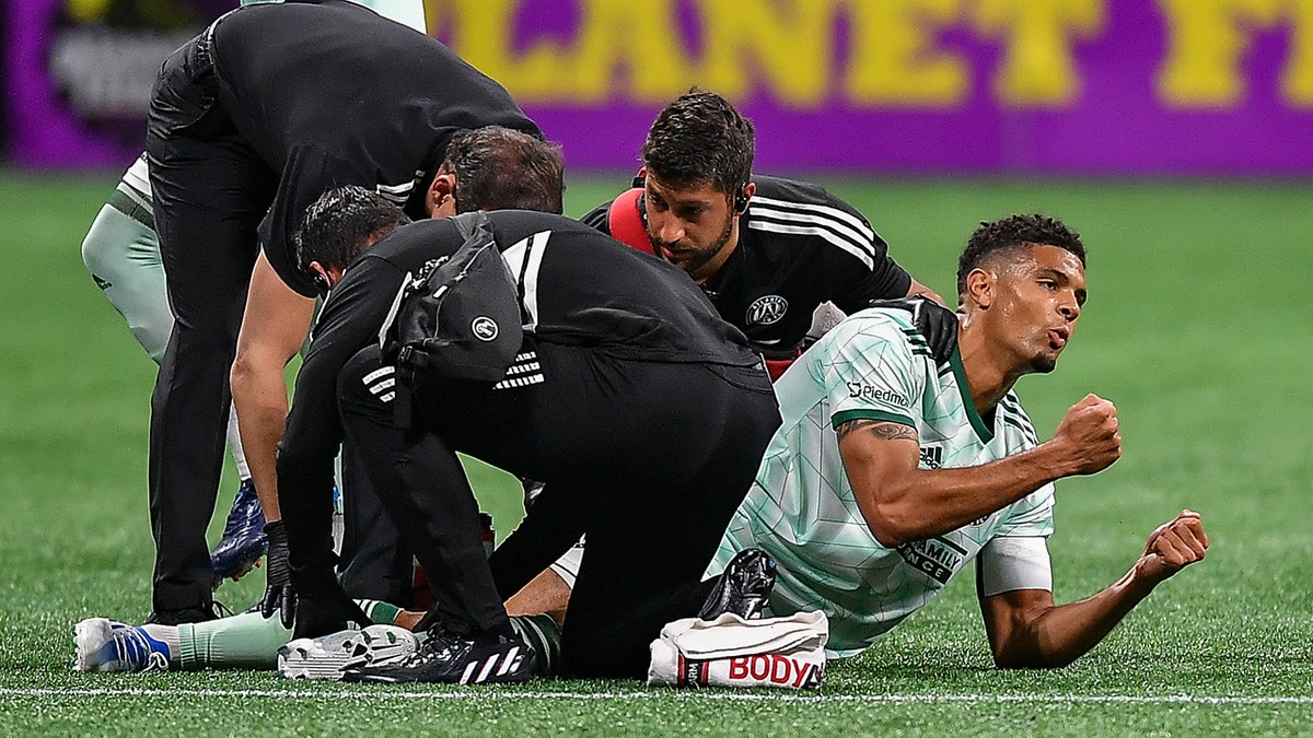 Atlanta defender Miles Robinson (12) reacts after injuring his leg during the MLS match between Chicago Fire and Atlanta United FC on May 7th, 2022 at Mercedes-Benz Stadium in Atlanta, GA.