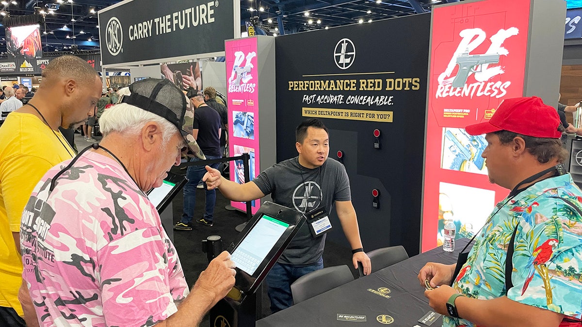 Different booths are shown on the exhibit floor of the 2022 NRA convention in Houston.