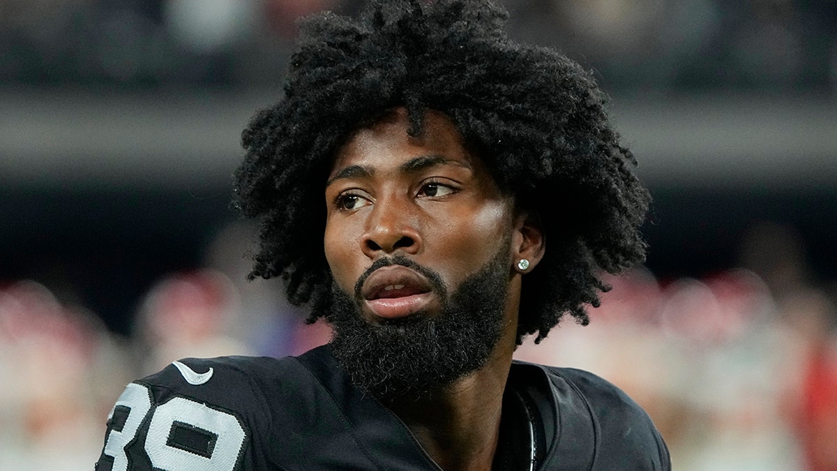 FILE - Las Vegas Raiders cornerback Nate Hobbs warms up before an NFL football game against the Kansas City Chiefs, Nov. 14, 2021, in Las Vegas.