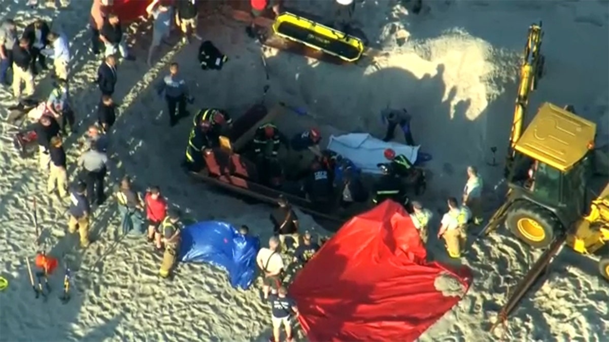 New Jersey first responders rescued a 17-year-old girl, but her 18-year-old brother died after becoming trapped beneath the sand