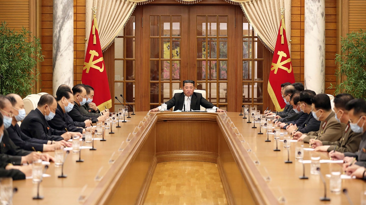 In this photo provided by the North Korean government, North Korean leader Kim Jong Un, center, attends a meeting of the Central Committee of the ruling Workers' Party in Pyongyang, North Korea Thursday, May 12, 2022. (Korean Central News Agency/Korea News Service via AP)