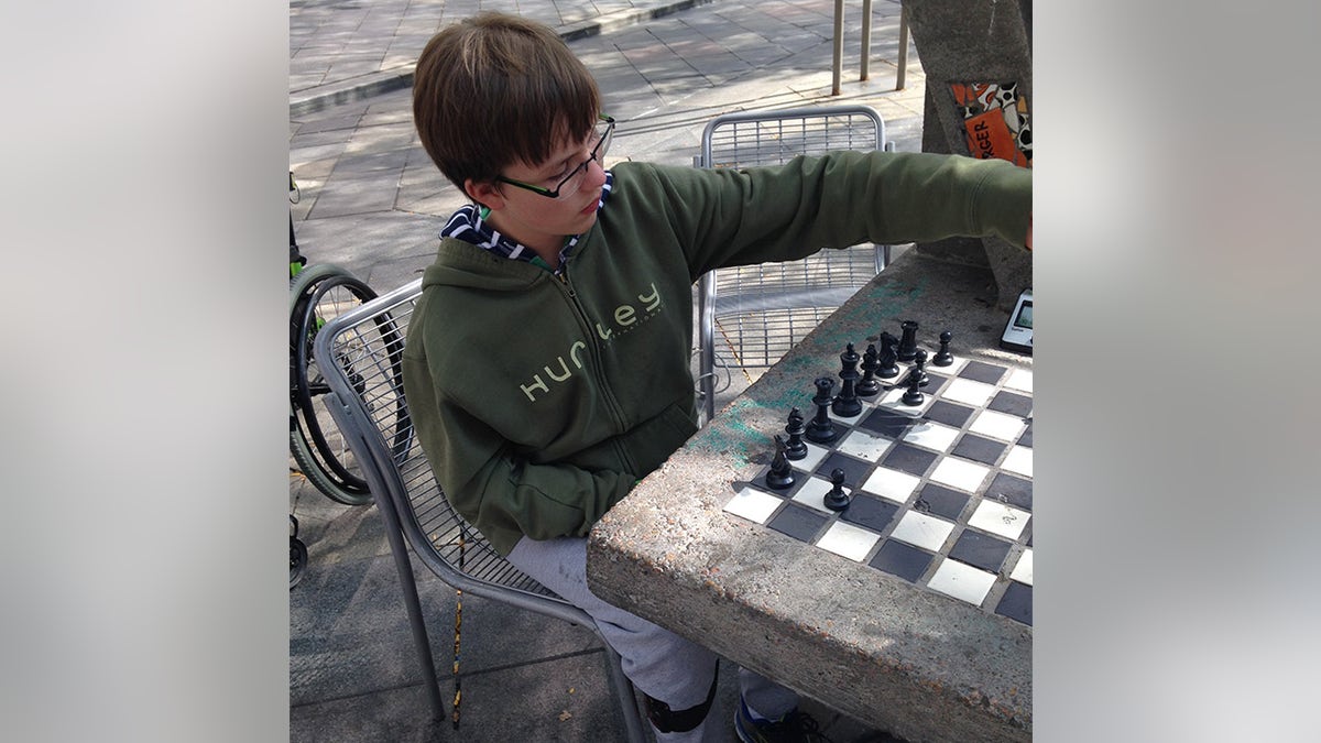 Griffin McConnell playing chess in 2015.