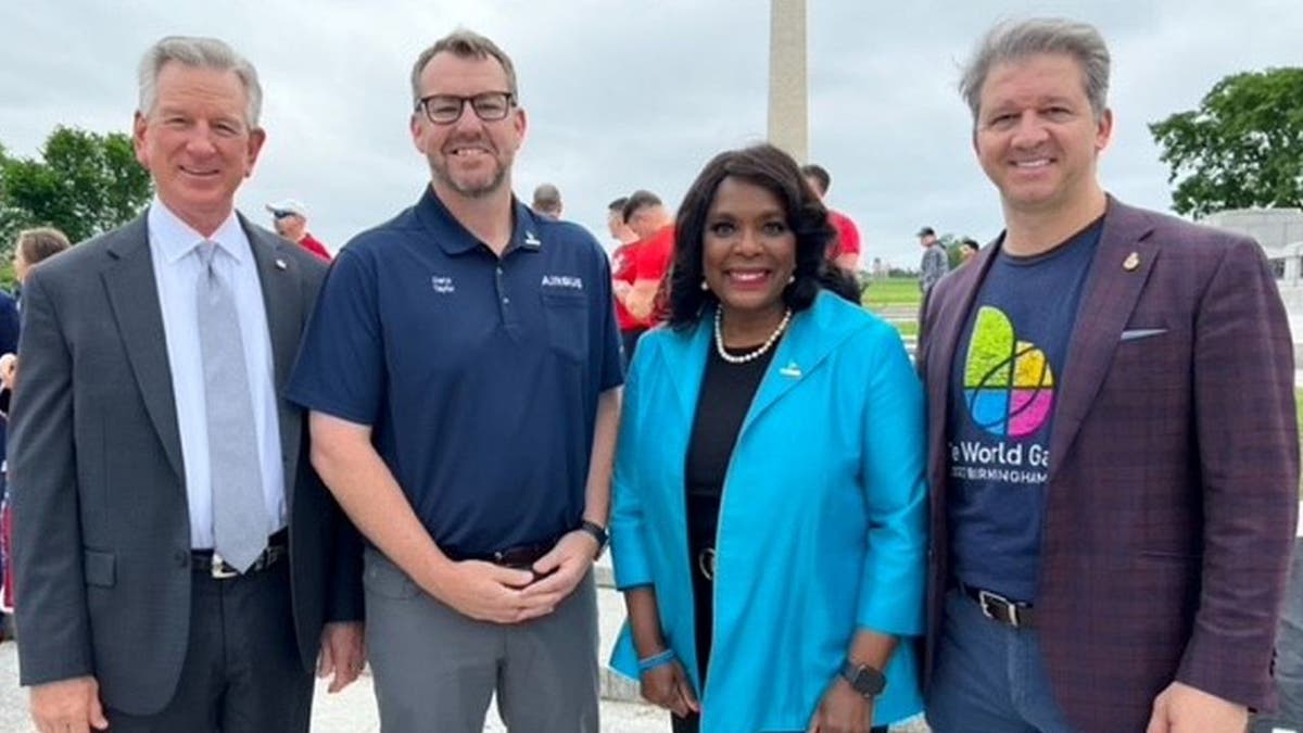 Alabama Senator Tommy Tuberville, Airbus Vice President Daryl Taylor, Alabama Congresswoman Terri Sewell and The World Games 2022 CEO Nick Sellers stand together.