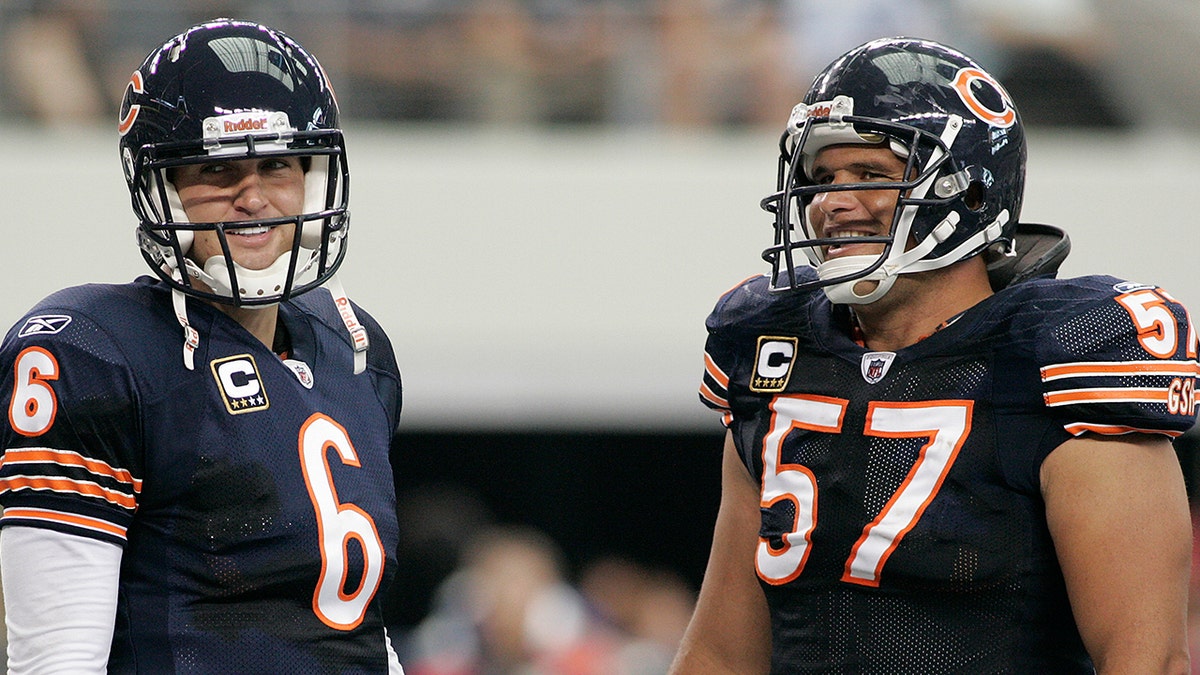 Chicago Bears quarterback Jay Cutler and center Olin Kreutz share a laugh near the end of their game against the Dallas Cowboys at Cowboys Stadium in Arlington, Texas, Sunday, Sept. 19, 2010.
