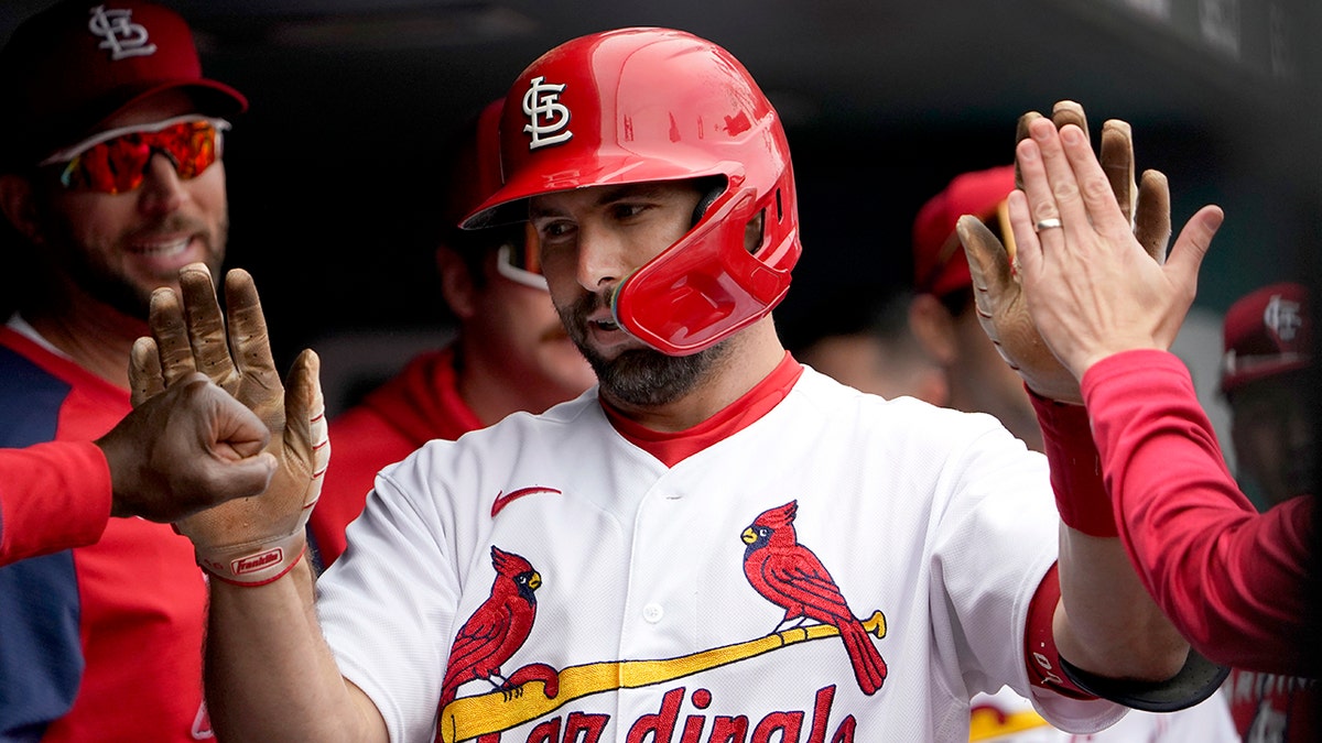 Paul Goldschmidt high-fives teammates