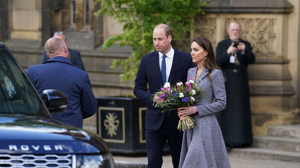 William and the Duchess of Cambridge leave after attending the launch of the Glade of Light Memorial, outside Manchester Cathedral.