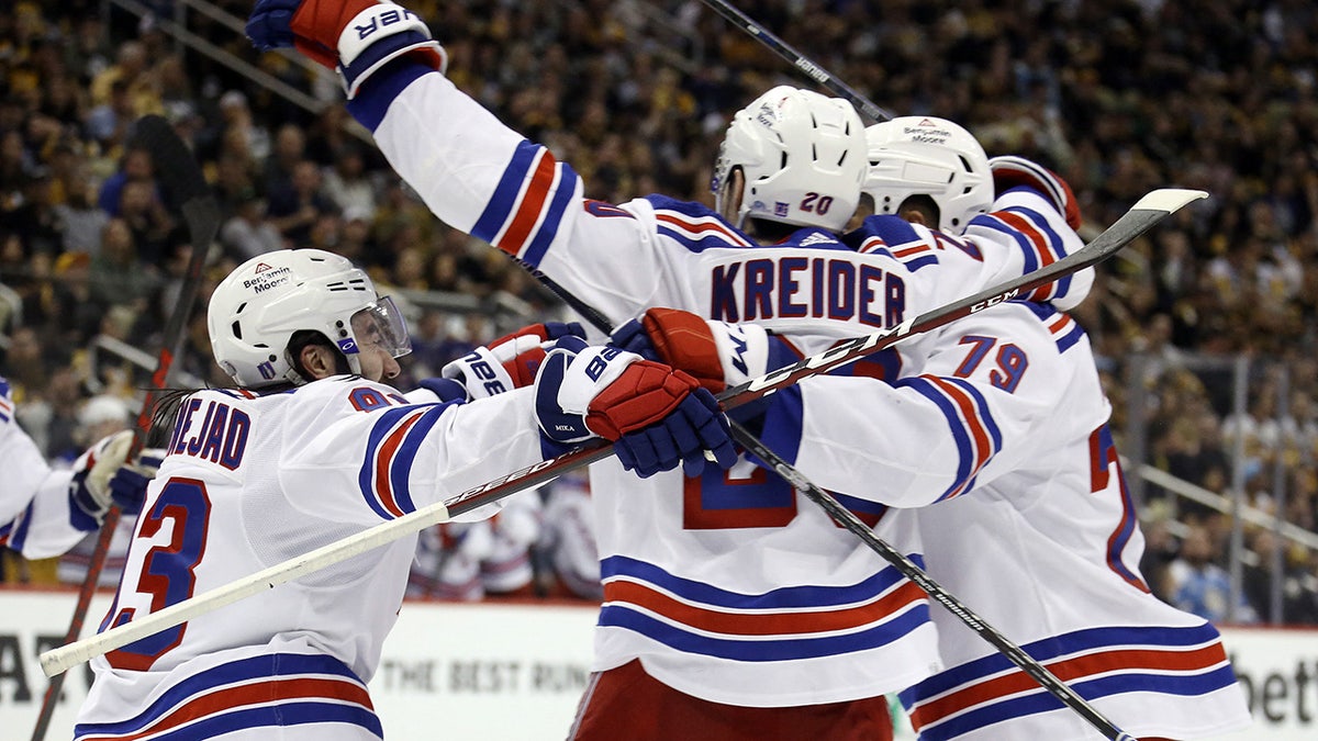 May 13, 2022; Pittsburgh, Pennsylvania, USA;  The New York Rangers celebrate the game winning goal scored by Rangers left wing Chris Kreider (20) against the Pittsburgh Penguins during the third period in game six of the first round of the 2022 Stanley Cup Playoffs at PPG Paints Arena. The Rangers won 5-3.  Mandatory Credit: Charles LeClaire-USA TODAY Sports