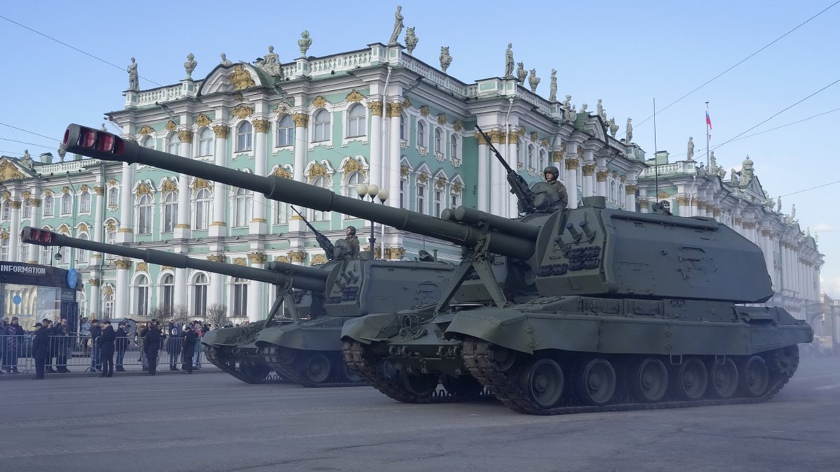 Self-propelled artillery vehicles Msta-S drive past the Winter Palace during a rehearsal for the Victory Day military parade in St. Petersburg, Russia, on Thursday, April 28.