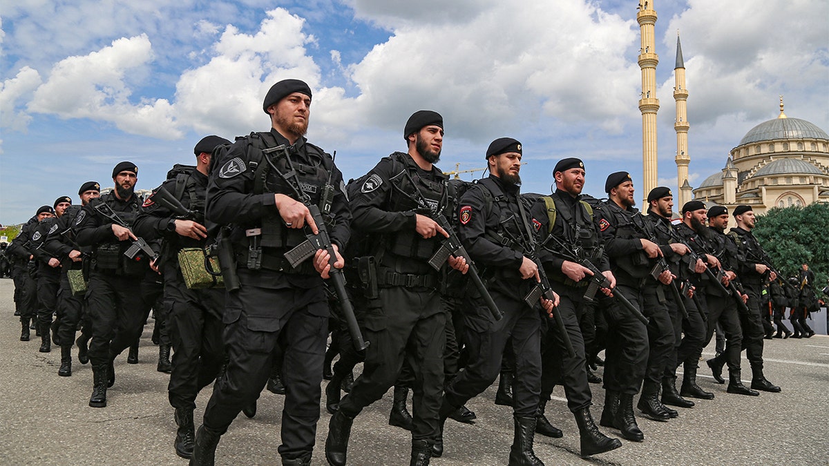 Service members take part in a military parade on Victory Day, which marks the 77th anniversary of the victory over Nazi Germany in World War II, in the Chechen capital Grozny, Russia May 9, 2022. REUTERS/Chingis Kondarov