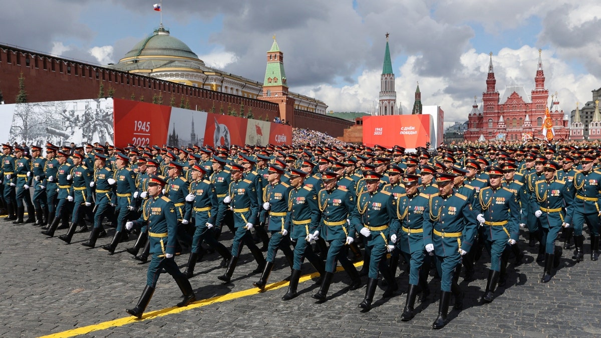 Russian service members march