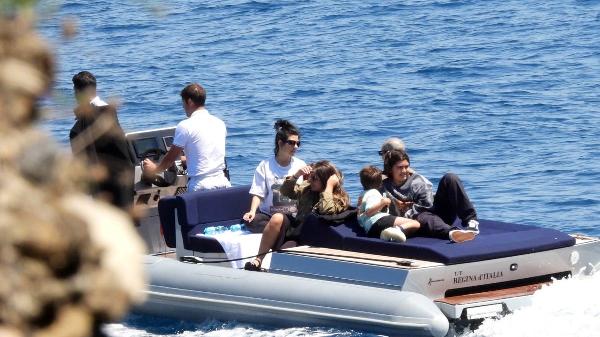 Kourtney Kardashian and Travis Barker take the kids out in Italy