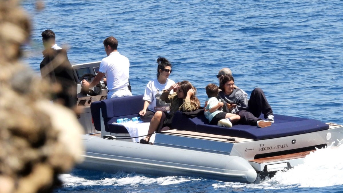 Kourtney Kardashian and Travis Barker take the kids out in Italy