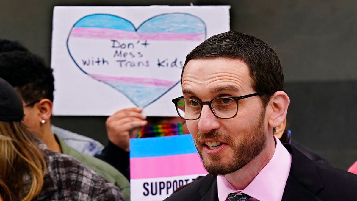 FILE: State Sen. Scott Wiener, D-San Francisco, discusses his proposed measure to provide legal refuge to displaced transgender youth and their families during a news conference in Sacramento, Calif., March 17, 2022.