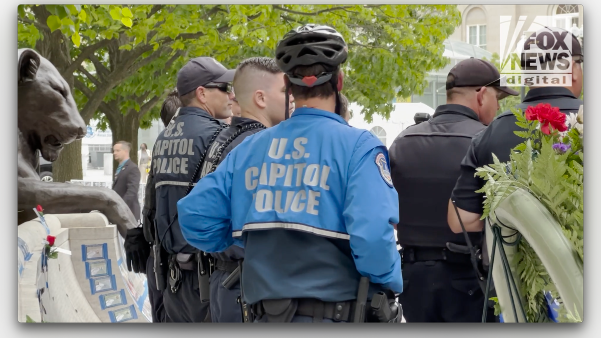 Capitol police with jackets and helmets standing outdoors