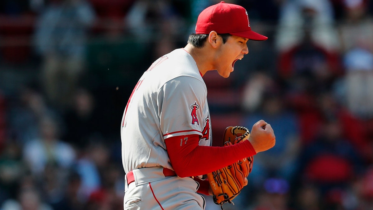 Los Angeles Angels' Shohei Ohtani reacts after striking out Boston Red Sox's Trevor Story during the seventh inning of a baseball game, Thursday, May 5, 2022, in Boston.