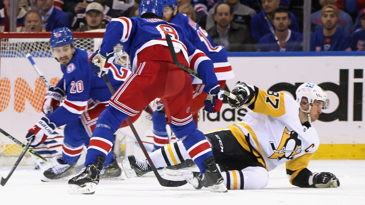 Jacob Trouba #8 of the New York Rangers checks Sidney Crosby #87 of the Pittsburgh Penguins in Game Five of the First Round of the 2022 Stanley Cup Playoffs at Madison Square Garden on May 11, 2022 in New York City. Crosby left the game shortly after the hit.