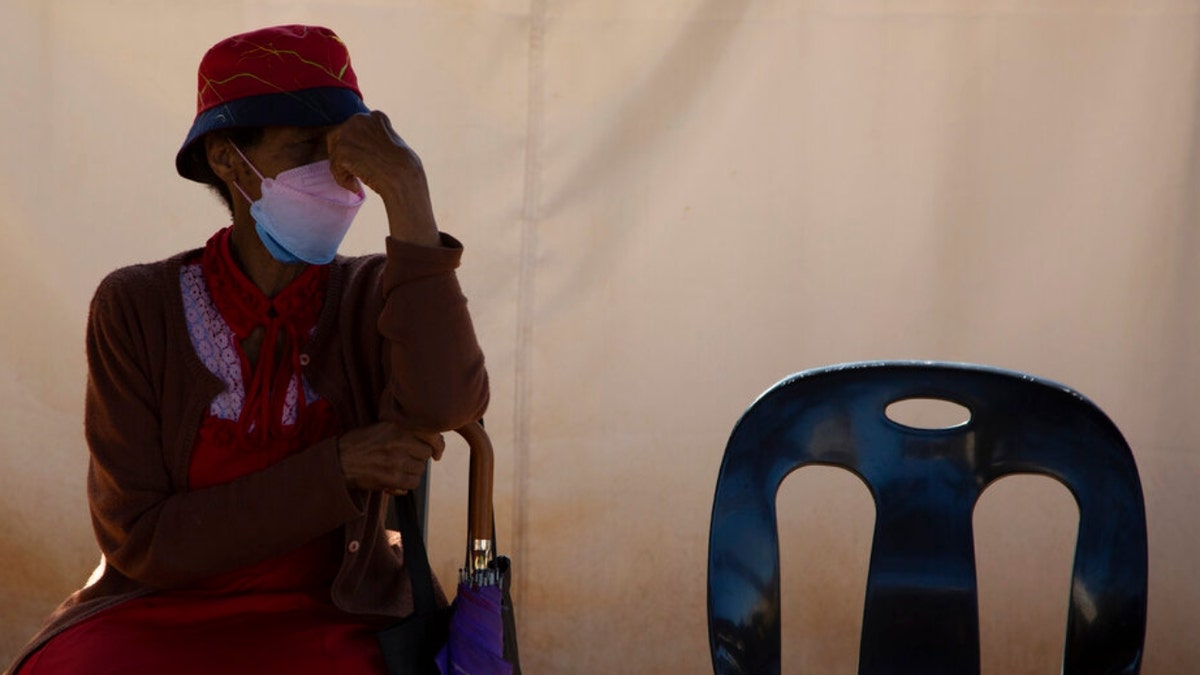 A woman in line for a COVID-19 screening in South Africa