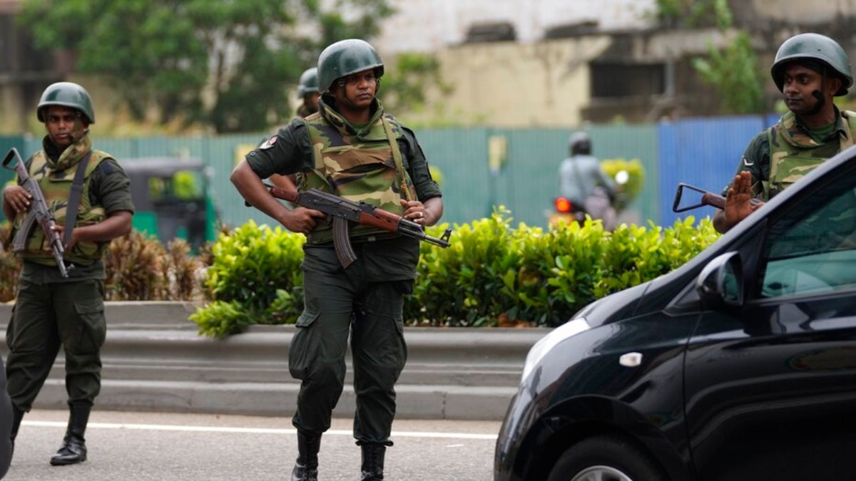 Sri Lankan army soldiers stand guard