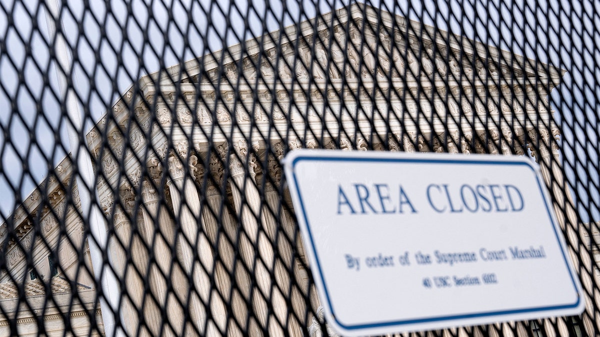 The U.S. Supreme Court is seen through a fence with a "Closed Area" sign in Washington, May 11, 2022. (Photo by STEFANI REYNOLDS/AFP via Getty Images)