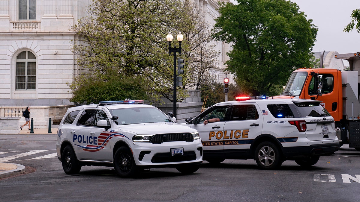 Police vehicles and heavy trucks block access to Supreme Court Building in Washington, Wednesday, May 4, 2022, as security measure are enhanced on the perimeter following protests sparked by news that the court might overturn cases that guarantee abortions. (AP Photo/J. Scott Applewhite)