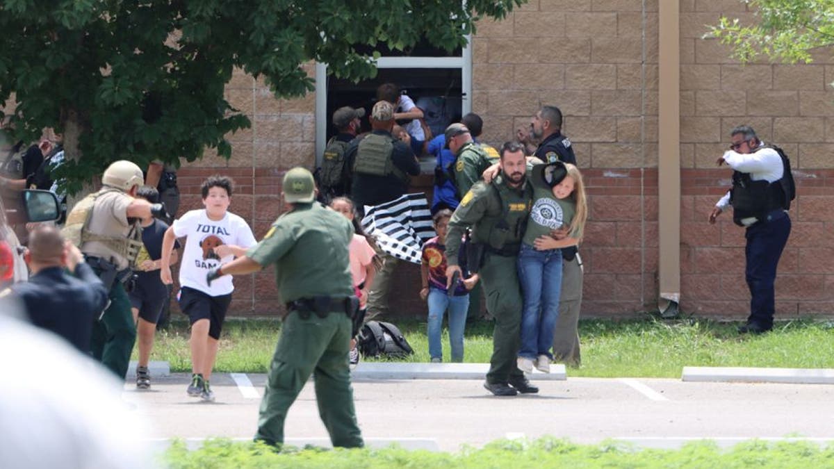 Children run to safety during a mass shooting