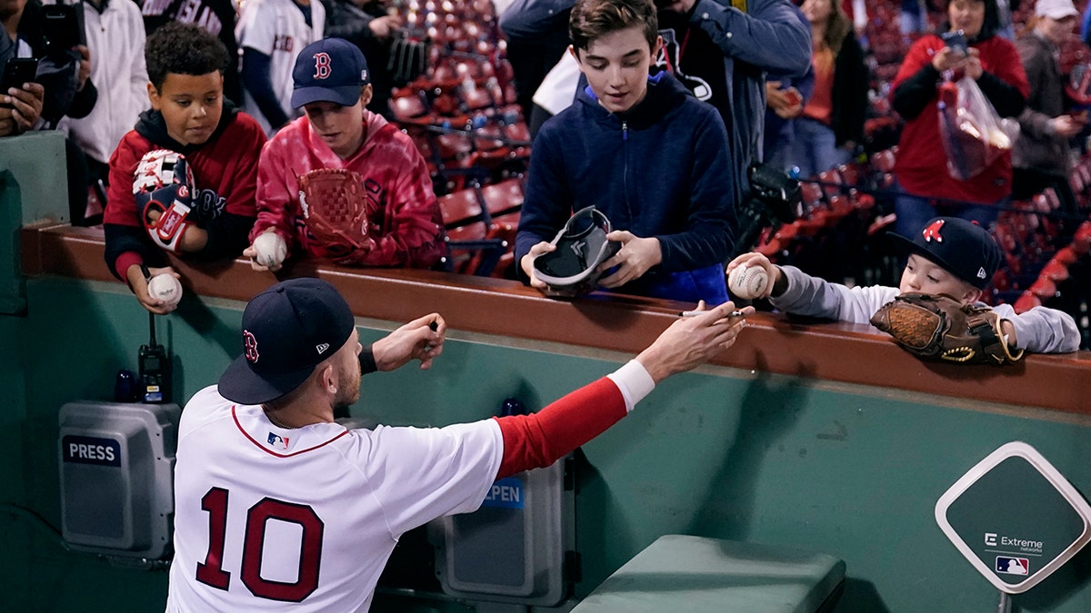 Red Sox's Trevor Story signs autographs