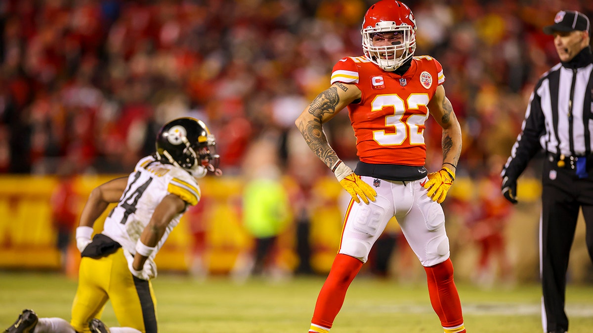 Tyrann Mathieu #32 of the Kansas City Chiefs reacts to a Chiefs defensive penalty during the third quarter near Ray-Ray McCloud #14 of the Pittsburgh Steelers during the AFC Wild Card Playoff game at Arrowhead Stadium on Jan. 16, 2022 in Kansas City, Missouri.