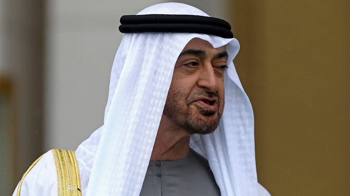 FILE - Sheikh Mohammed bin Zayed Al Nahyan, the Crown Prince of the United Arab Emirates, speaks to Turkey's President Recep Tayyip Erdogan during a welcoming ceremony at the presidential palace, in Ankara, Turkey, on Nov. 24, 2021. (AP Photo/Burhan Ozbilici, File)