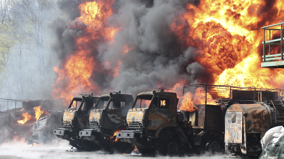 Vehicles are seen in flames at an oil depot after missiles struck the facility in an area controlled by Russian-backed separatist forces in Makiivka,  eastern Ukraine, on Wednesday, May 4.