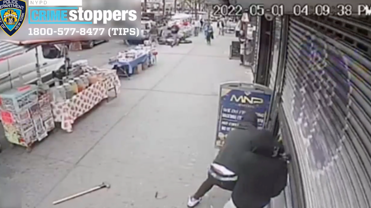 The New York Police Department released a video showing a person in a black shirt, ski mask, and white shoes approaching a jewelry store on Sunday and repeatedly smashing a sledgehammer into the window.