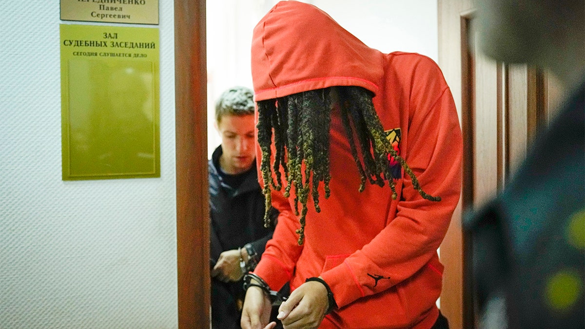 WNBA star and two-time Olympic gold medalist Brittney Griner leaves a courtroom after a hearing, in Khimki just outside Moscow, Russia, Friday, May 13, 2022. (AP Photo/Alexander Zemlianichenko)