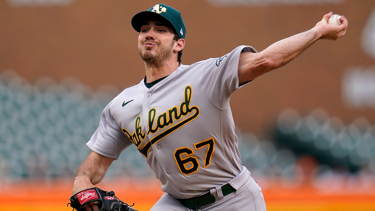 Oakland Athletics pitcher Zach Logue throws against the Detroit Tigers in the first inning of a baseball game in Detroit, Wednesday, May 11, 2022. 