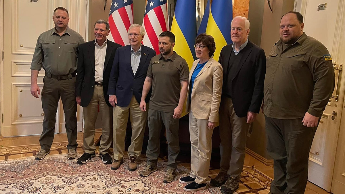 Ukrainian President Volodymy Zelenskyy takes a photo with Senate Minority Leader Mitch McConnell, Sens. John Barrasso, Susan Collins and John Cornyn, left to right, Saturday, May 14, 2022.