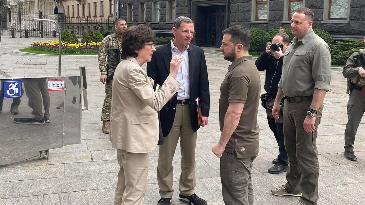 Ukrainian President Volodymy Zelenskyy speaks with Republican Sens. Susan Collins of Maine and John Barrasso of Wyoming, Saturday, May 14, 2022.