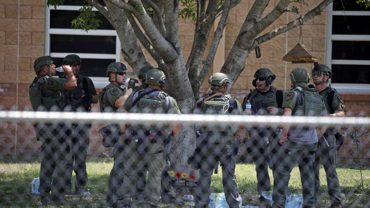 Police outside Robb Elementary school in Uvalde, Texas