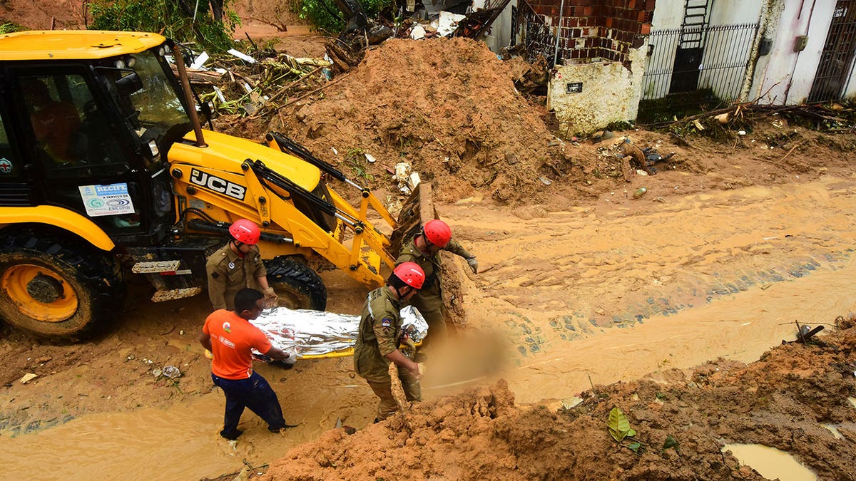 Brazilian firefighters in landslide