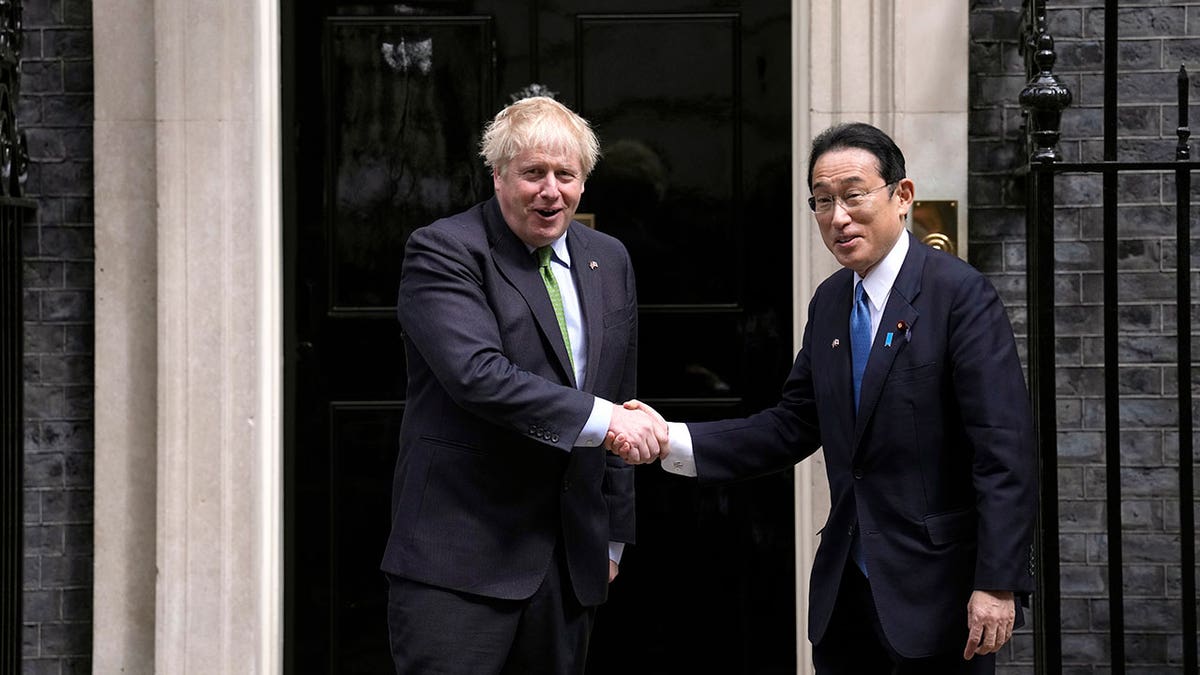 British Prime Minister Boris Johnson, left, greets Japanese Prime Minister Fumio Kishida before their meeting at 10 Downing Street in London, Thursday, May 5, 2022. (AP Photo/Matt Dunham)