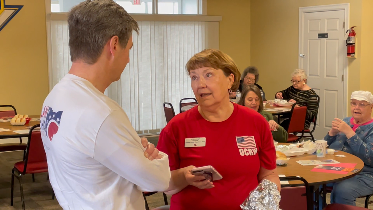 Ohio state Sen. Matt Dolan, who is running in the state's Senate GOP primary, speaks with a voter at an Ottawa Republican Women's Club event in Port Clinton, Ohio. (Tyler Olson/Fox News)