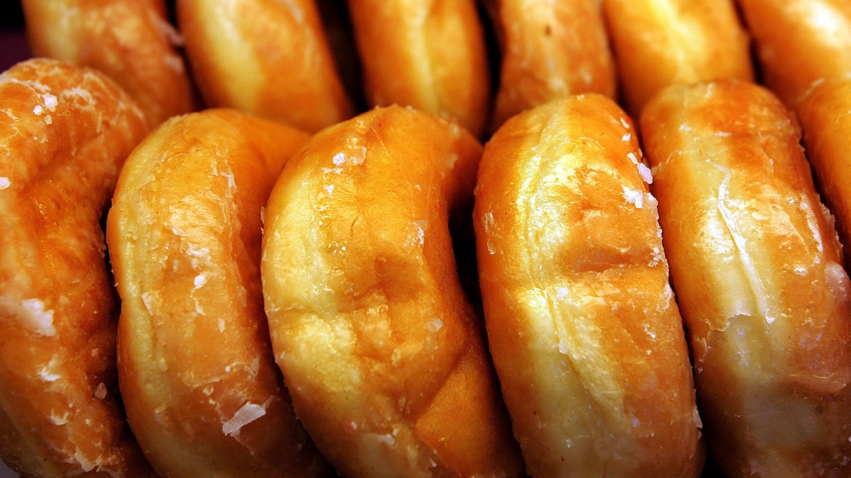 Glazed donuts are displayed at a Dunkin' Donuts store on Sept. 7, 2006, in Chicago, Illinois. In Massachusetts, the state donut in the Boston Cream.