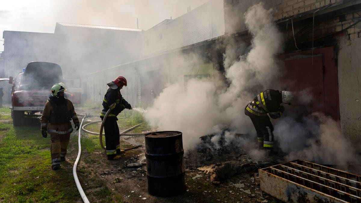 Ukrainian firefighters battle smoke from Russian attack