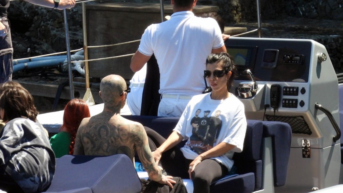 Kourtney Kardashian and Travis Barker enjoy a boat in Italy
