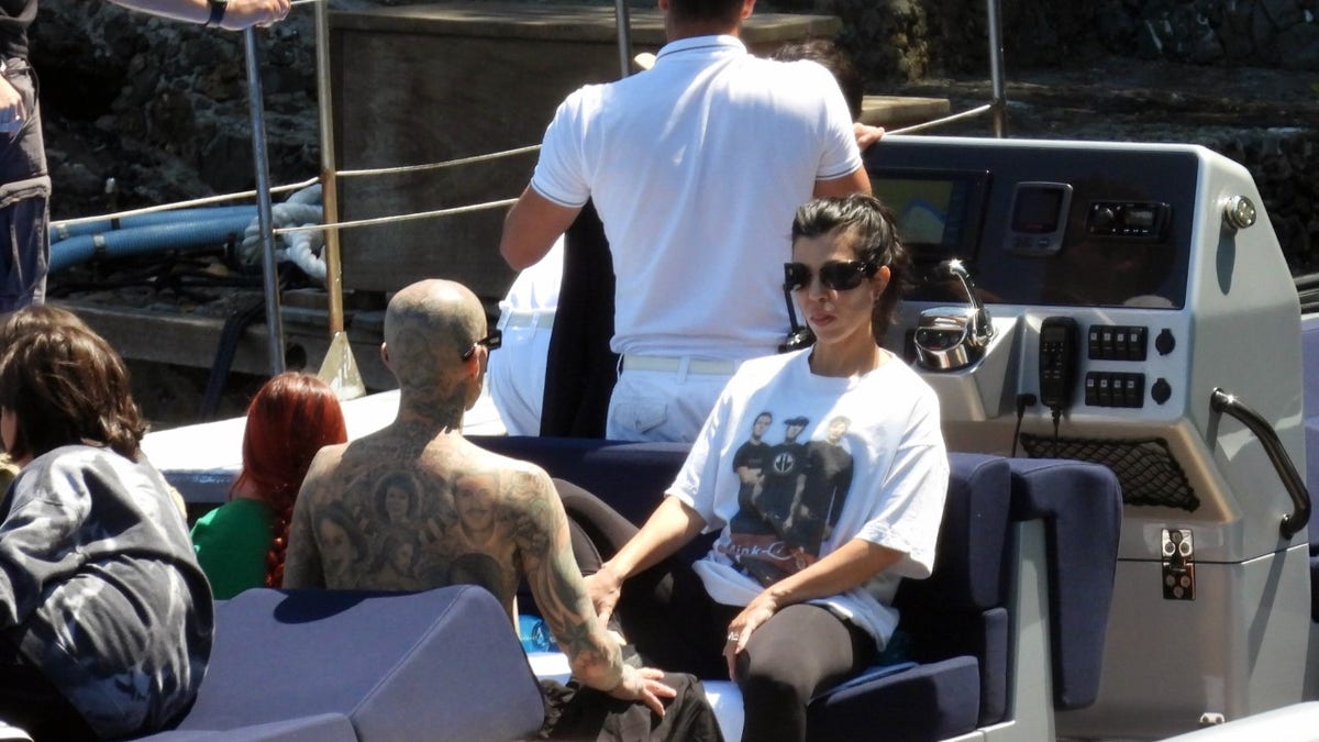 Kourtney Kardashian and Travis Barker enjoy a boat in Italy