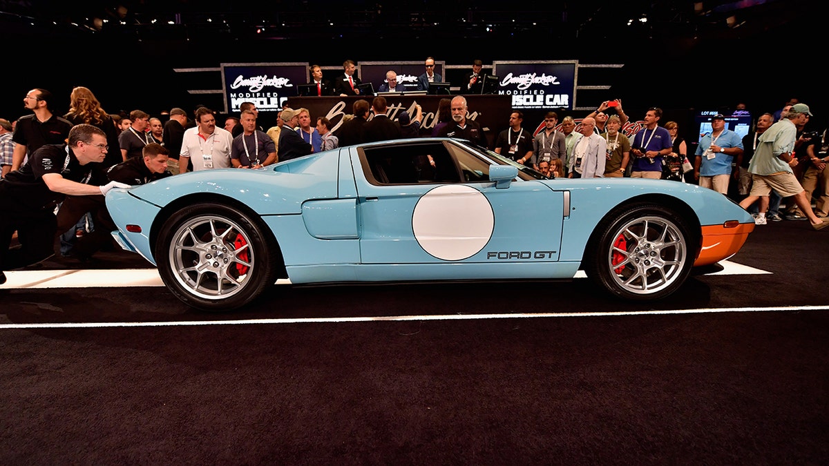 A different 2006 Ford GT Heritage Edition is auctioned at a Barrett-Jackson in 2016. 