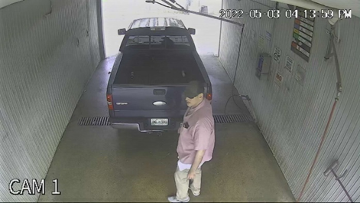 Photo provided by USMS on May 9, 2022, shows a man standing next to a 2006 Ford F-150 had been abandoned at a car wash in the 2000 block of South Weinbach Avenue in Evansville.