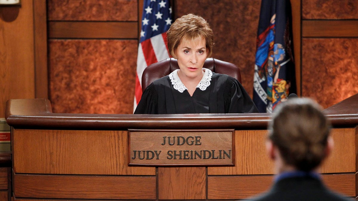 Judge Judy sits on the stand