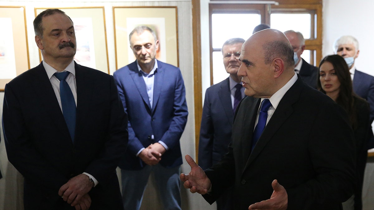 L-R: Governor of Dagestan Sergei Melikov, Russian billionaire, businessman and Council of the Federation Member Suleiman Kerimov and Prime Minister Mikhail Mishustin attend a presentation at the Naryn Kala Castle, on April 14, 2021, in Derbent, Dagestan, Russia. 