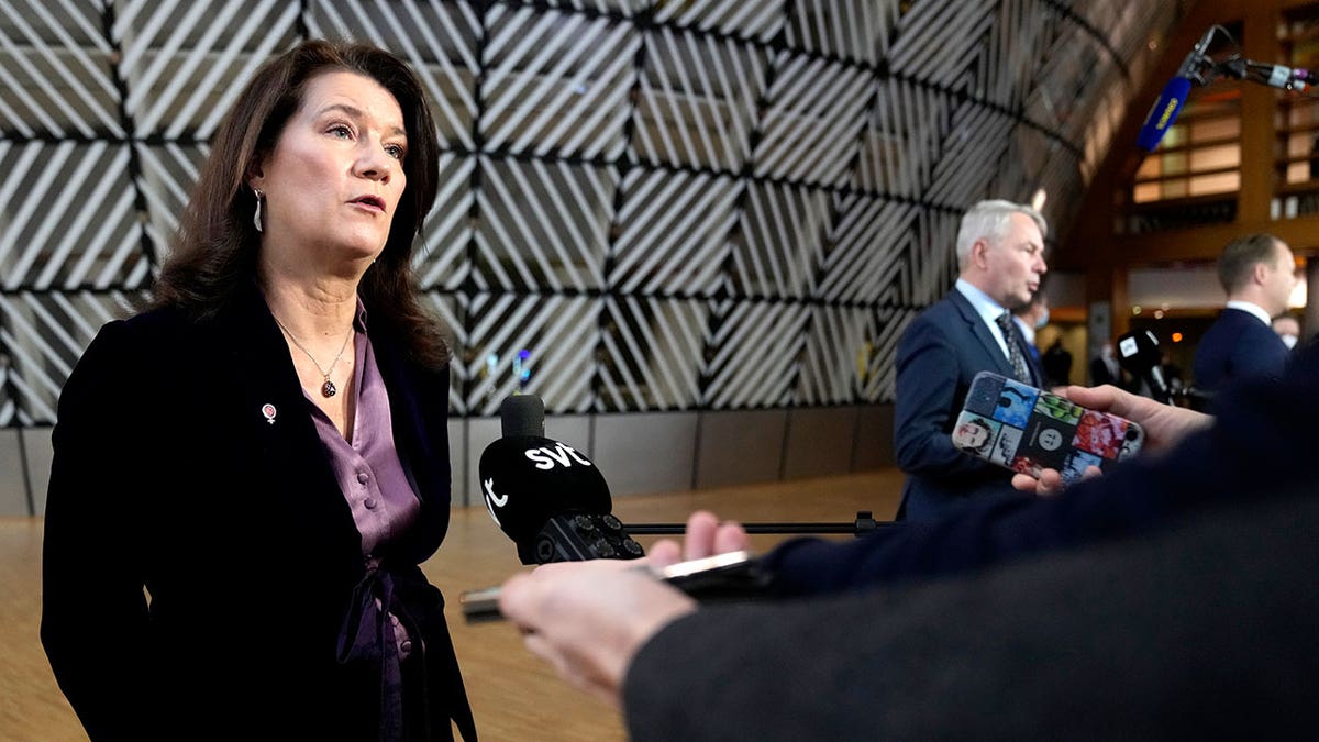 FILE - Sweden's Foreign Minister Ann Linde, left, and Finland's Foreign Minister Pekka Haavisto, right, speak with the media as the arrive for a meeting of EU foreign ministers at the European Council building in Brussels, Jan. 24, 2022. The question of whether to join NATO is coming to a head in Finland and Sweden, where Russia's invasion of Ukraine has shattered the long-held belief that remaining outside the military alliance was the best way to avoid trouble with their giant neighbor. (AP Photo/Virginia Mayo, File)