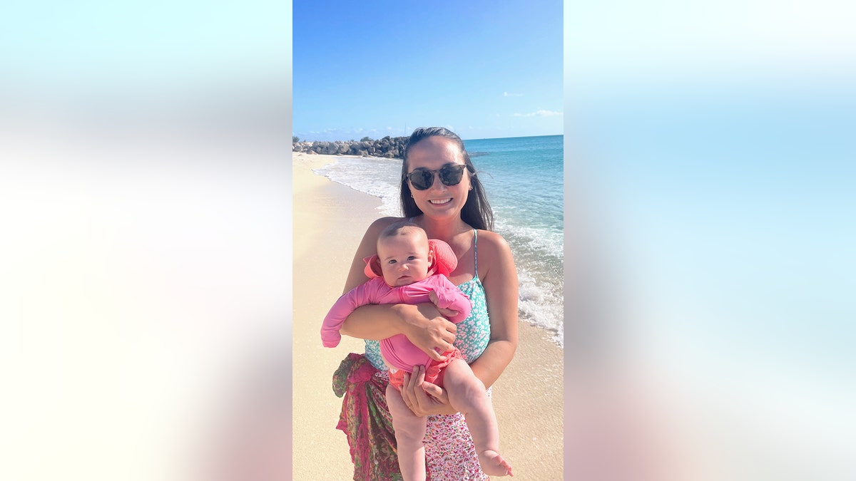 Michelle Schroeder-Gardner with her baby on vacation, ,