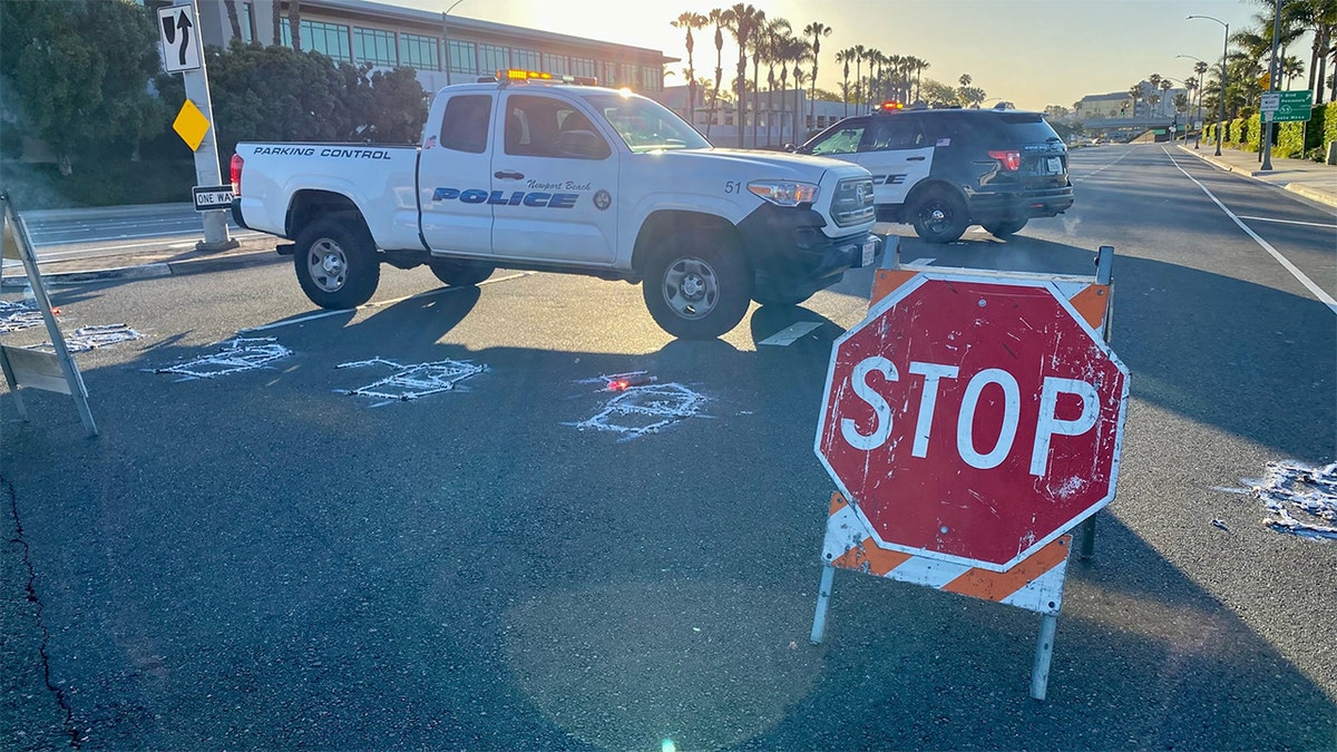 Newport Beach police vehicles close the Pacific Coast Highway